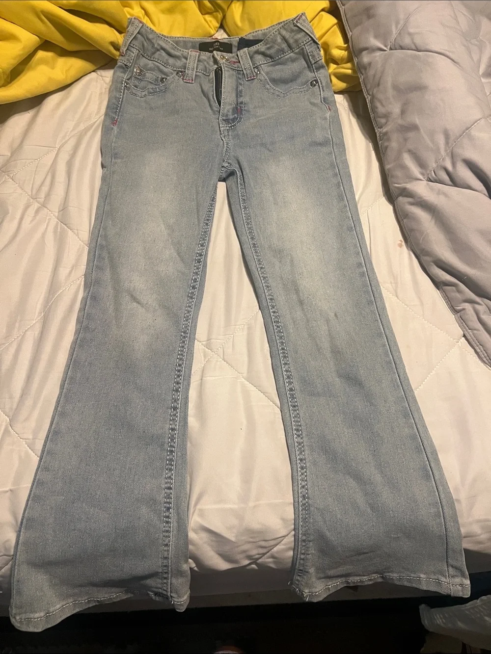 True Religion Light Wash Flare Jeans with Pink Pocket Stitching